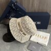 DIOR Bucket Hat, Ultra-Elegant with Deepened Silhouette Enhancing the Look, Featuring Contrasting Trim Embroidered with Bold 'Christian Dior Paris' Lettering