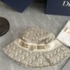 DIOR Bucket Hat, Ultra-Elegant with Deepened Silhouette Enhancing the Look, Featuring Contrasting Trim Embroidered with Bold 'Christian Dior Paris' Lettering
