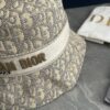 DIOR Bucket Hat, Ultra-Elegant with Deepened Silhouette Enhancing the Look, Featuring Contrasting Trim Embroidered with Bold 'Christian Dior Paris' Lettering