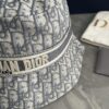 DIOR Bucket Hat for Men and Women, Deepened Design Exudes Elegance, Contrasting Trim with Bold 'Christian Dior Paris' Logo Embroidery