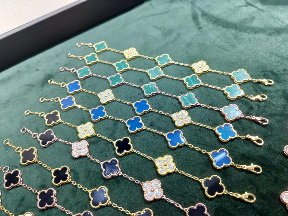 Van Cleef & Arpels VCA Five-Flower Bracelet, Authentic Design! The four-leaf mother-of-pearl motif features smooth, elegant lines with hand-polished small beads for a full, three-dimensional appearance. Custom lobster clasp with exclusive anti-counterfeit code—each bracelet carries a unique identification number, ensuring authenticity. Hand-engraved chain links, each with four faceted surfaces, showcase impeccable craftsmanship and refined elegance. Beautiful when worn alone or layered.