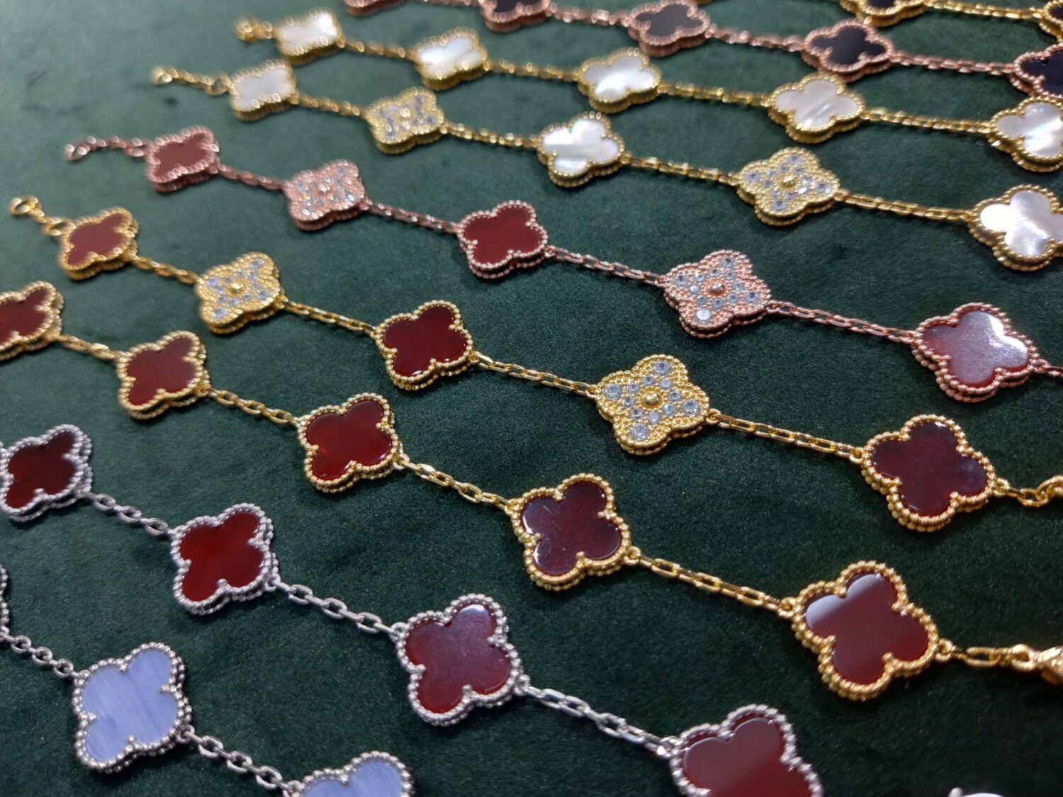 Van Cleef & Arpels VCA Five-Flower Bracelet, Authentic Design! The four-leaf mother-of-pearl motif features smooth, elegant lines with hand-polished small beads for a full, three-dimensional appearance. Custom lobster clasp with exclusive anti-counterfeit code—each bracelet carries a unique identification number, ensuring authenticity. Hand-engraved chain links, each with four faceted surfaces, showcase impeccable craftsmanship and refined elegance. Beautiful when worn alone or layered.