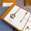 LV Circle Pendant Suspends Gracefully Within Interwoven Lines of the Exquisitely Crafted Metal Chain, Infusing the Garden Louise Long Necklace with Artistic Elegance