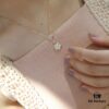 Exquisitely Crafted ZP LV Jewelry with Classic Floral Design, White Shell, Pink Rhombus Shell, and Accented with a Small Diamond