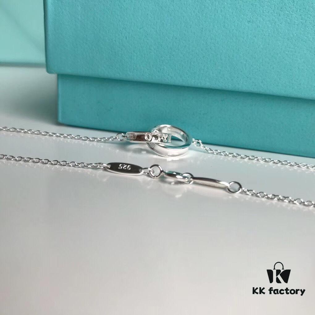 Tiffany & Co. T1837 Double Ring Necklace with Toggle Closure, Fashionable Silver Pendant Inspired by the Brand's Founding Year