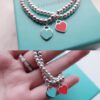 Woman Wearing Tiffany Heart Bracelet