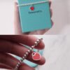 Woman Wearing Tiffany Heart Bracelet