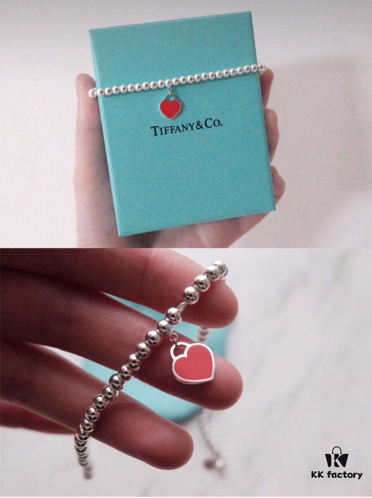 Woman Wearing Tiffany Heart Bracelet