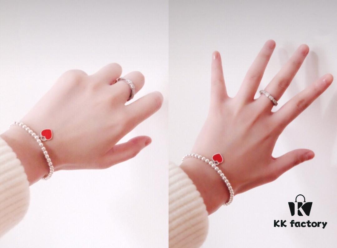 Woman Wearing Tiffany Heart Bracelet