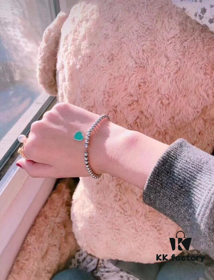 Woman Wearing Tiffany Heart Bracelet