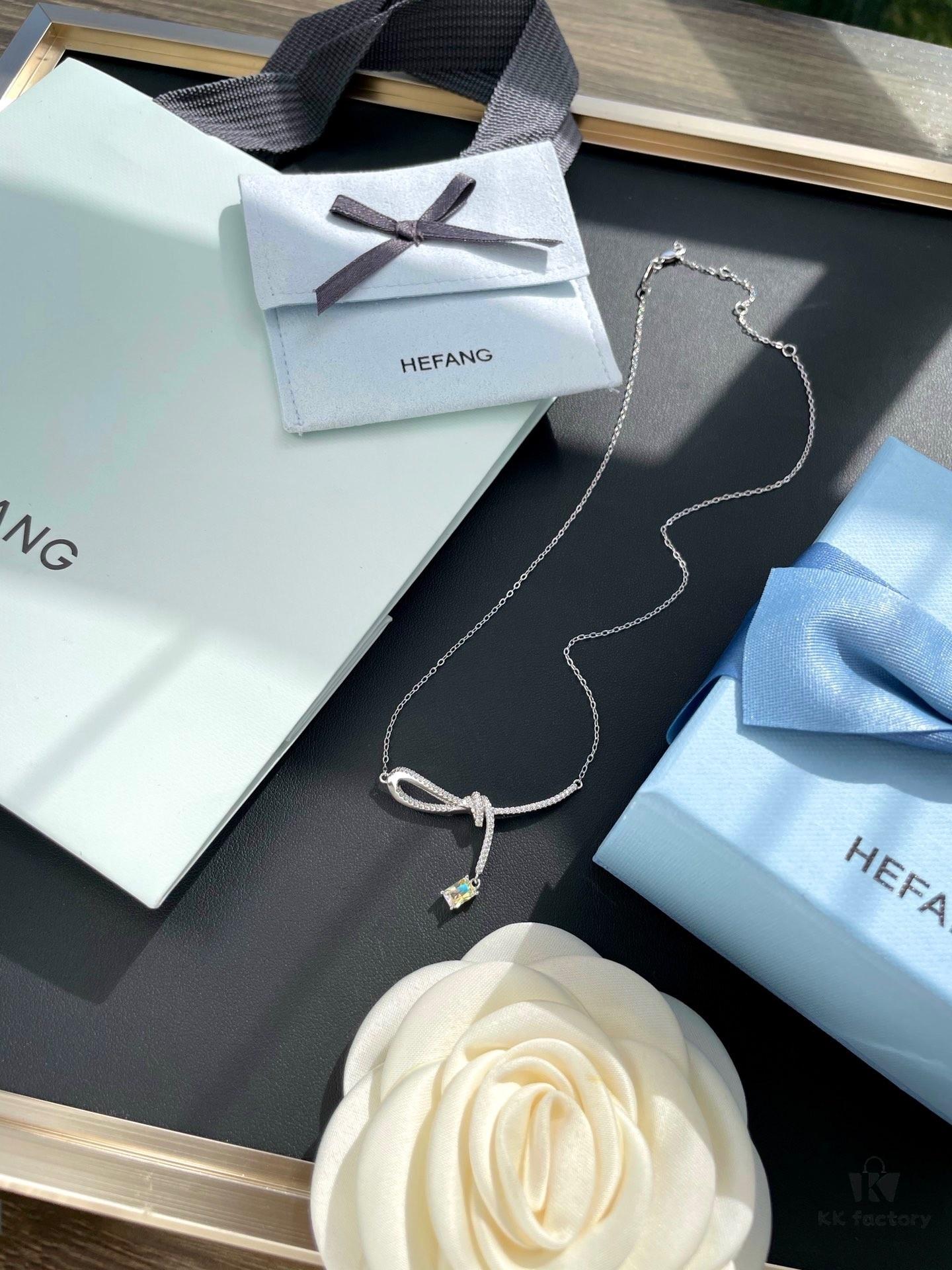 He Fang Aurora Ribbon Knot Collarbone Necklace, Exquisitely Crafted from S925 Silver with Shimmering Diamond Accents and Colorful Iridescent Cube Pendant