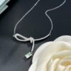 He Fang Aurora Ribbon Knot Collarbone Necklace, Exquisitely Crafted from S925 Silver with Shimmering Diamond Accents and Colorful Iridescent Cube Pendant