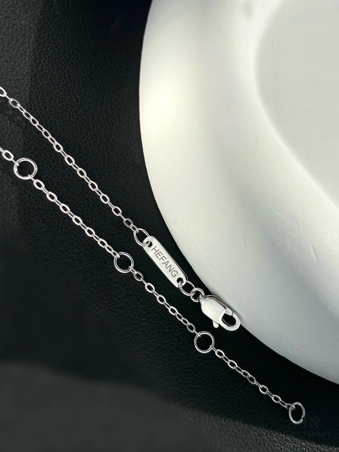 He Fang Aurora Ribbon Knot Collarbone Necklace, Exquisitely Crafted from S925 Silver with Shimmering Diamond Accents and Colorful Iridescent Cube Pendant