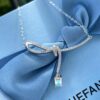 He Fang Aurora Ribbon Knot Collarbone Necklace, Exquisitely Crafted from S925 Silver with Shimmering Diamond Accents and Colorful Iridescent Cube Pendant