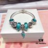 Pandora Mint Parrot New Arrival! Made with counter materials, perfectly crafted to match the original quality. Featuring mint moonstone glass, mint diamond-cut cat's eye, fairy tale pumpkin carriage, I Love You beads, mint parrot charm, refreshing and elegant. Comes with S925 silver and official retail packaging!