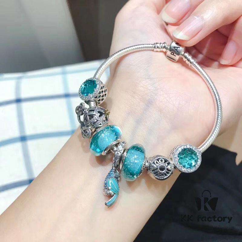 Pandora Mint Parrot New Arrival! Made with counter materials, perfectly crafted to match the original quality. Featuring mint moonstone glass, mint diamond-cut cat's eye, fairy tale pumpkin carriage, I Love You beads, mint parrot charm, refreshing and elegant. Comes with S925 silver and official retail packaging!