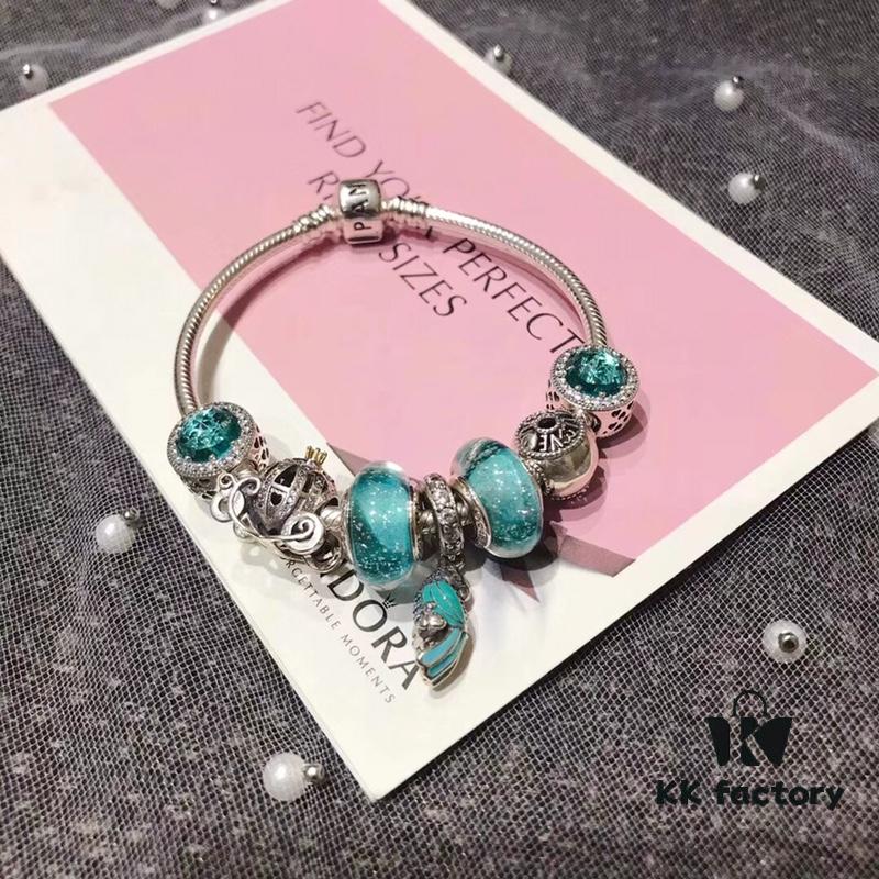 Pandora Mint Parrot New Arrival! Made with counter materials, perfectly crafted to match the original quality. Featuring mint moonstone glass, mint diamond-cut cat's eye, fairy tale pumpkin carriage, I Love You beads, mint parrot charm, refreshing and elegant. Comes with S925 silver and official retail packaging!