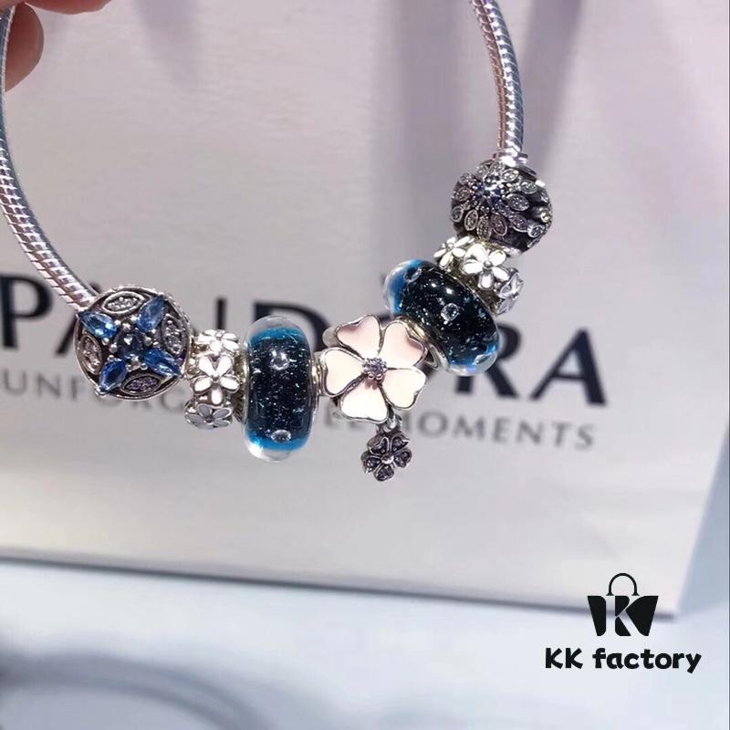 Pandora Night Sky Blue Elegant Pink Flower Design! Crafted with authentic boutique materials, perfectly replicating the original store quality. Features night sky blue bubbled glass, delicate cherry blossom spacers, cross snowflake charm, elegant pink flower accent, and is made of S925 silver, complete with official boutique packaging!