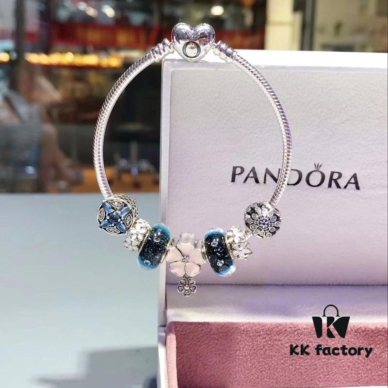 Pandora Night Sky Blue Elegant Pink Flower Design! Crafted with authentic boutique materials, perfectly replicating the original store quality. Features night sky blue bubbled glass, delicate cherry blossom spacers, cross snowflake charm, elegant pink flower accent, and is made of S925 silver, complete with official boutique packaging!