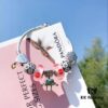 Pandora Pink Kiss 👄 New Bella Mini Doll Charm! Orange-pink lip enamel with white daisy enamel bead, Valentine's heart charm 💗, four-leaf clover spacer, paired with robot Bella pendant. Made from authentic materials, 1:1 replica with S925 silver and official retail packaging!