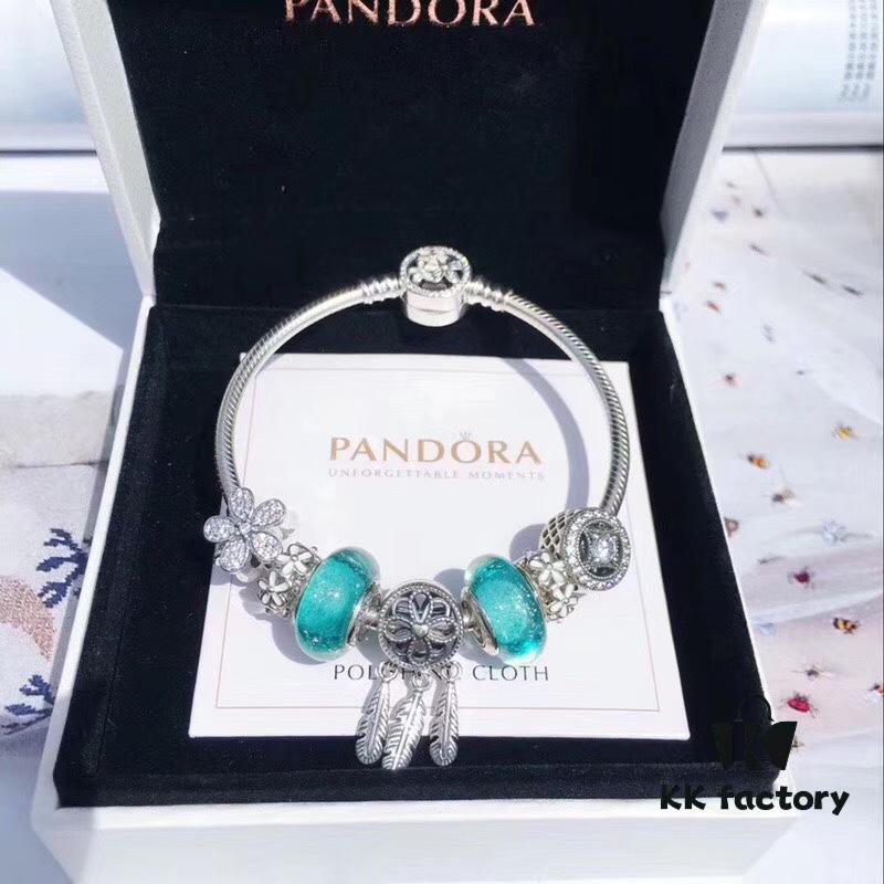 Pandora Night Glow Mint Dreamcatcher New Arrival! Crafted with authentic boutique materials, perfectly replicated to match retail quality. Features glow-in-the-dark mint glass beads, fully diamond-paved daisy flower spacers, lucky coin charm, daisy enamel separators, paired with a meaningful dreamcatcher pendant. Made in S925 silver and comes with official boutique packaging!