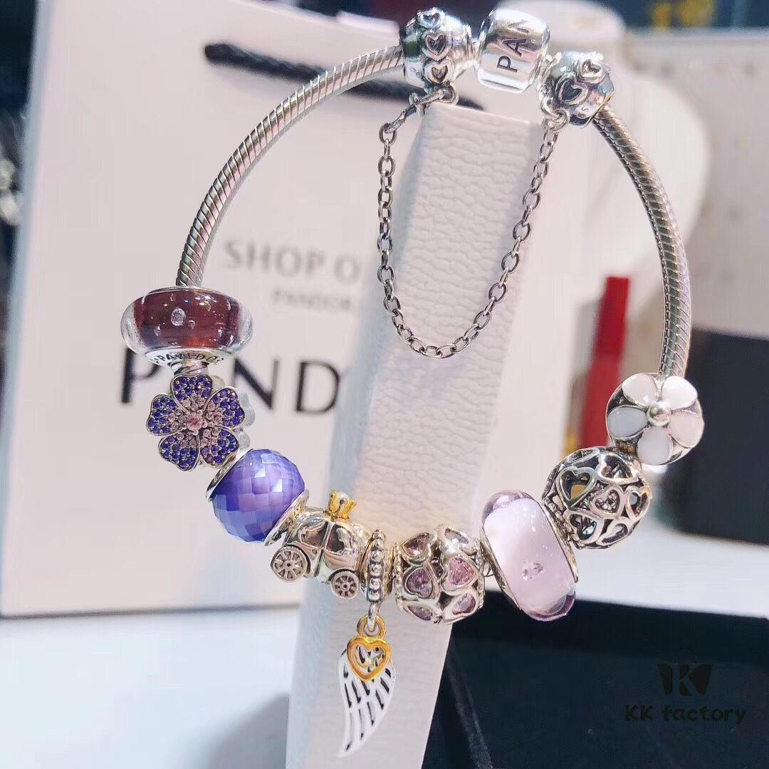 Pandora Pink and Purple Two-Tone Angel Wings New Arrival! Crafted with authentic boutique materials, perfectly replicated to match retail quality. Features pink heart glass beads, purple and brown two-tone glass beads, pumpkin carriage charm, pink heart charm, openwork heart charm, purple five-petal flower charm, and angel wings pendant.