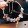 Pandora Pink and Purple Two-Tone Angel Wings New Arrival! Crafted with authentic boutique materials, perfectly replicated to match retail quality. Features pink heart glass beads, purple and brown two-tone glass beads, pumpkin carriage charm, pink heart charm, openwork heart charm, purple five-petal flower charm, and angel wings pendant.