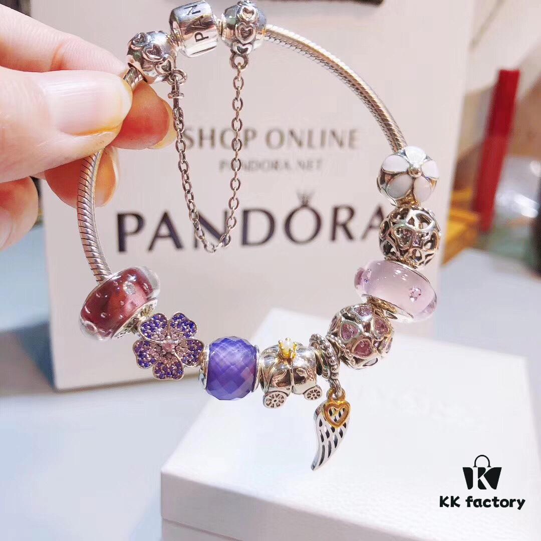 Pandora Pink and Purple Two-Tone Angel Wings New Arrival! Crafted with authentic boutique materials, perfectly replicated to match retail quality. Features pink heart glass beads, purple and brown two-tone glass beads, pumpkin carriage charm, pink heart charm, openwork heart charm, purple five-petal flower charm, and angel wings pendant.