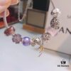 Pandora Pink and Purple Two-Tone Angel Wings New Arrival! Crafted with authentic boutique materials, perfectly replicated to match retail quality. Features pink heart glass beads, purple and brown two-tone glass beads, pumpkin carriage charm, pink heart charm, openwork heart charm, purple five-petal flower charm, and angel wings pendant.