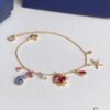 Swarovski OCEAN Marine Life Bicolor Colorful Bracelet for Women, Golden Chain with Gradient Seahorse, Crab Charm and Starfish Detail, Adjustable Fit, Perfect Gift for Her
