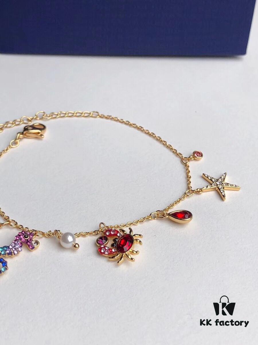 Swarovski OCEAN Marine Life Bicolor Colorful Bracelet for Women, Golden Chain with Gradient Seahorse, Crab Charm and Starfish Detail, Adjustable Fit, Perfect Gift for Her