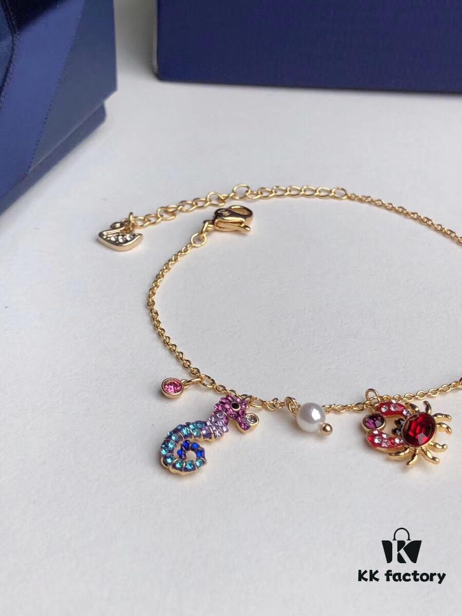 Swarovski OCEAN Marine Life Bicolor Colorful Bracelet for Women, Golden Chain with Gradient Seahorse, Crab Charm and Starfish Detail, Adjustable Fit, Perfect Gift for Her