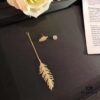 APM Monaco Single Gold-Tone Silver Crystal-Encrusted Feather Earring, Long Tassel Design with Moving Feathers That Sway in the Wind, Ear Stud Can Be Worn Separately – Showcase Video Available