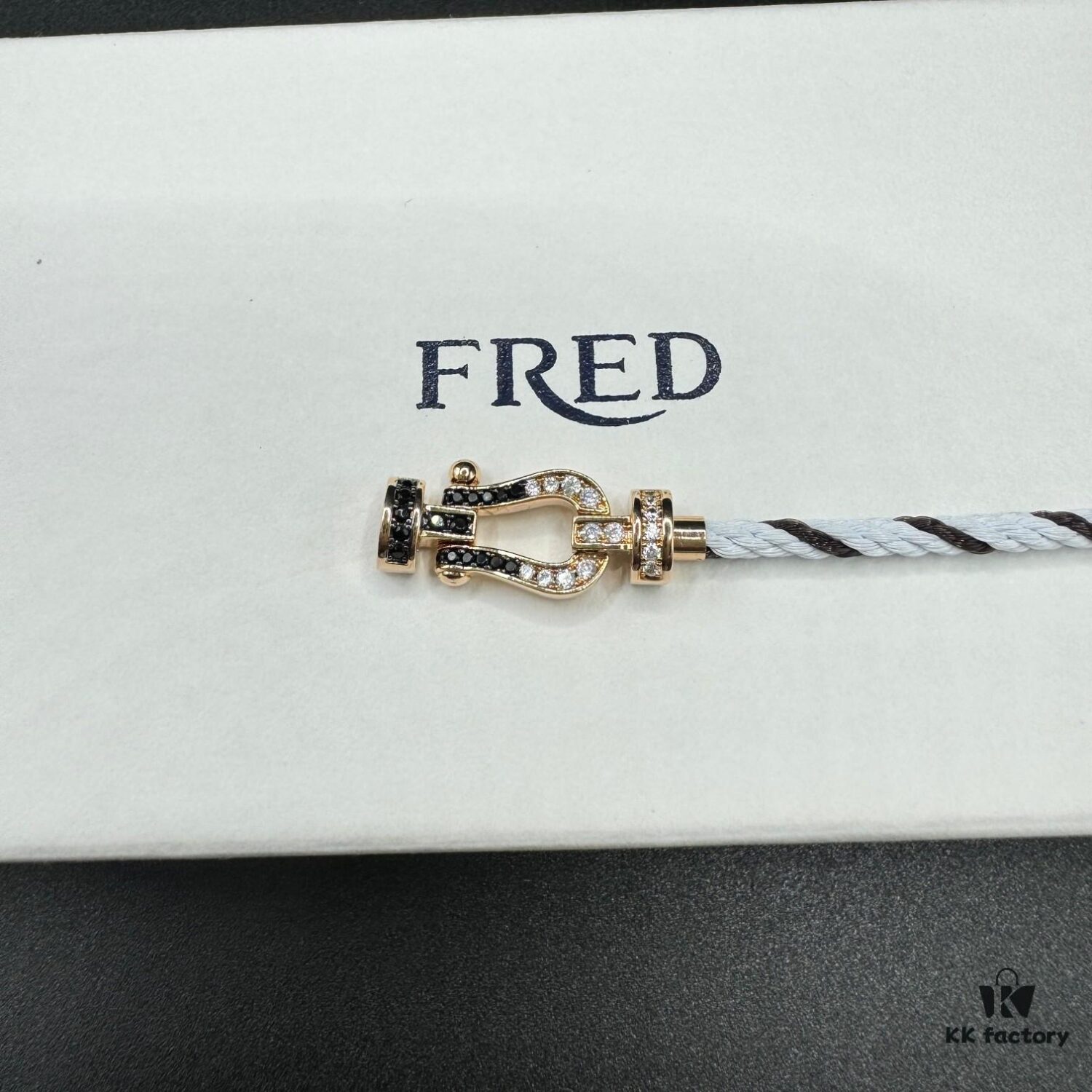 FRED Force 10 Bracelet in Rose Gold, Medium Size with Black and White Gemstones, Steel Cord Design