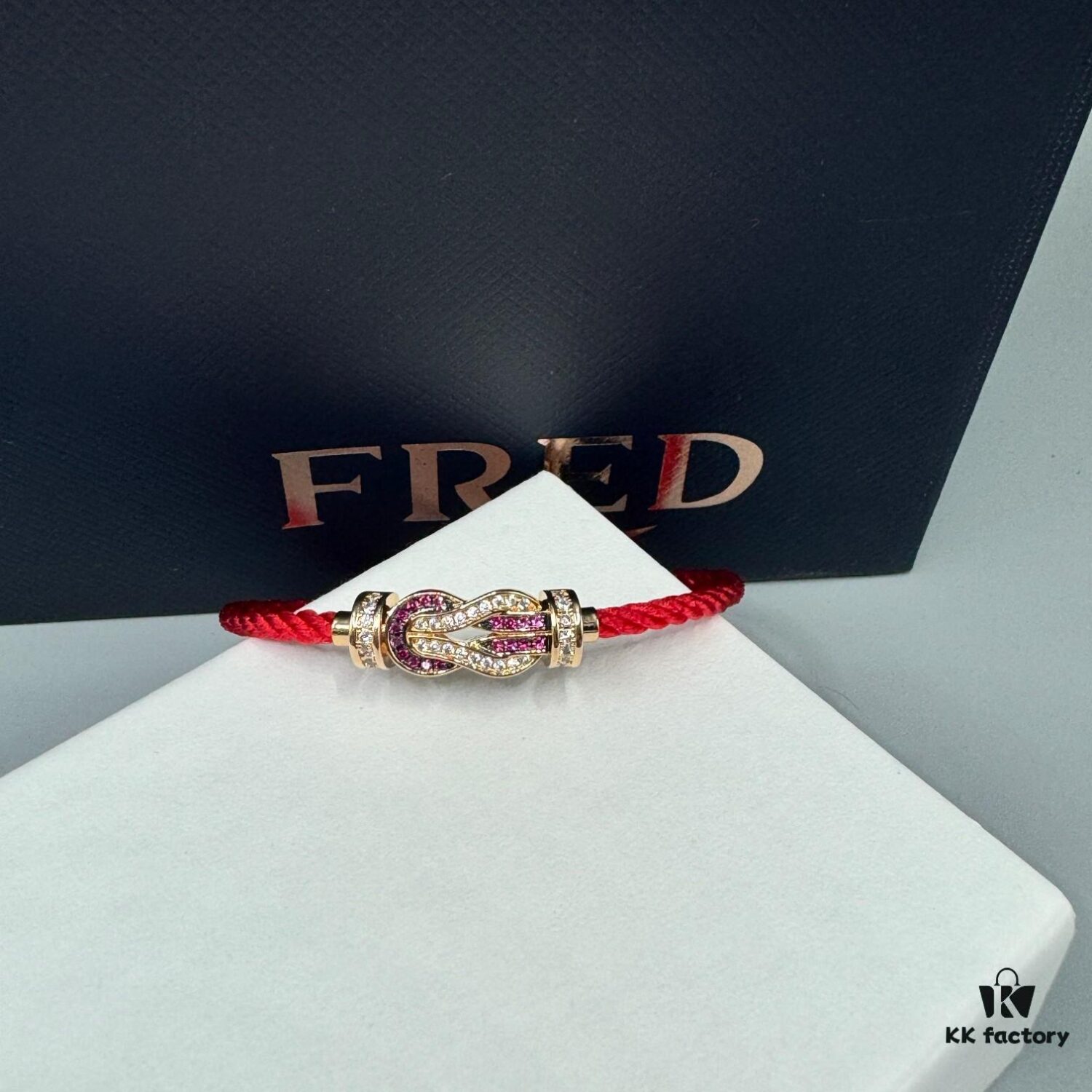 FRED Force 10 Bracelet in Rose Gold with Ruby, Medium Size, Red Sapphire Model, Steel Cord Design