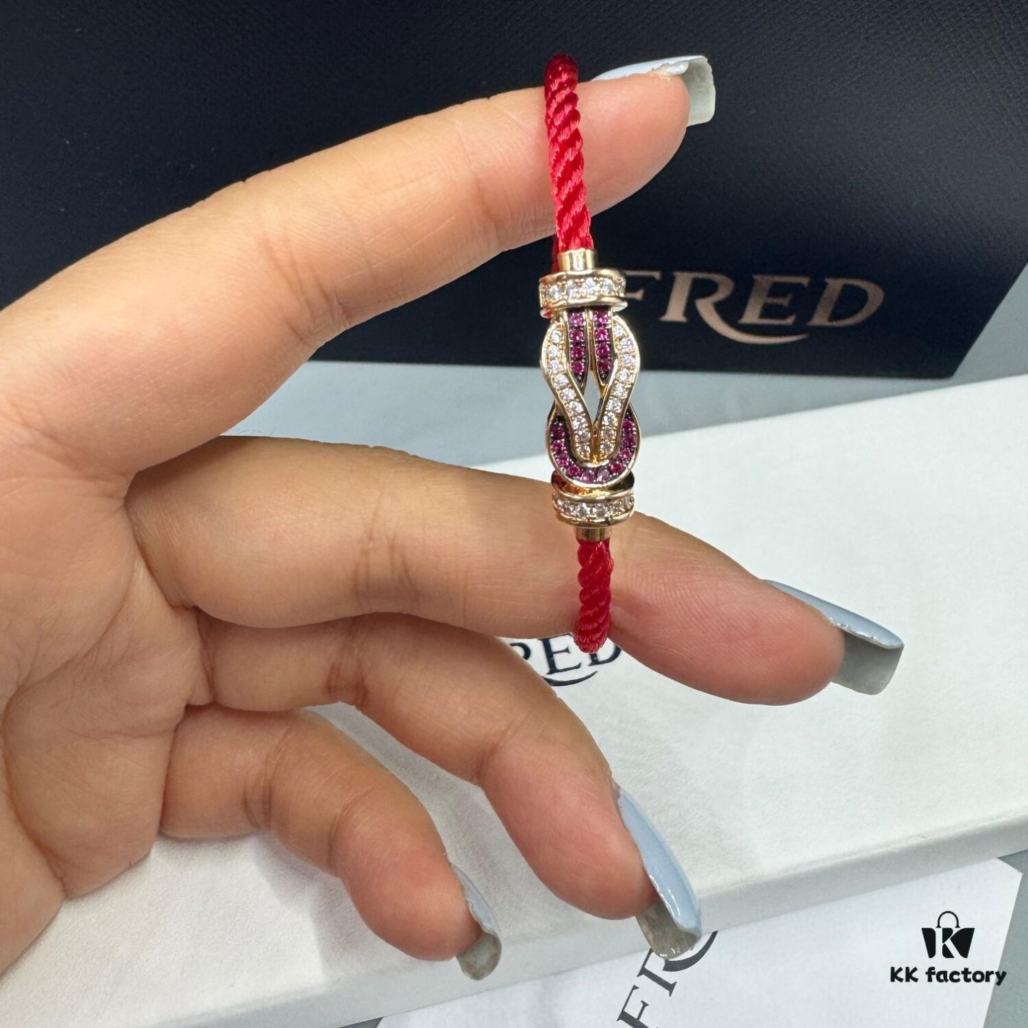 FRED Force 10 Bracelet in Rose Gold with Ruby, Medium Size, Red Sapphire Model, Steel Cord Design