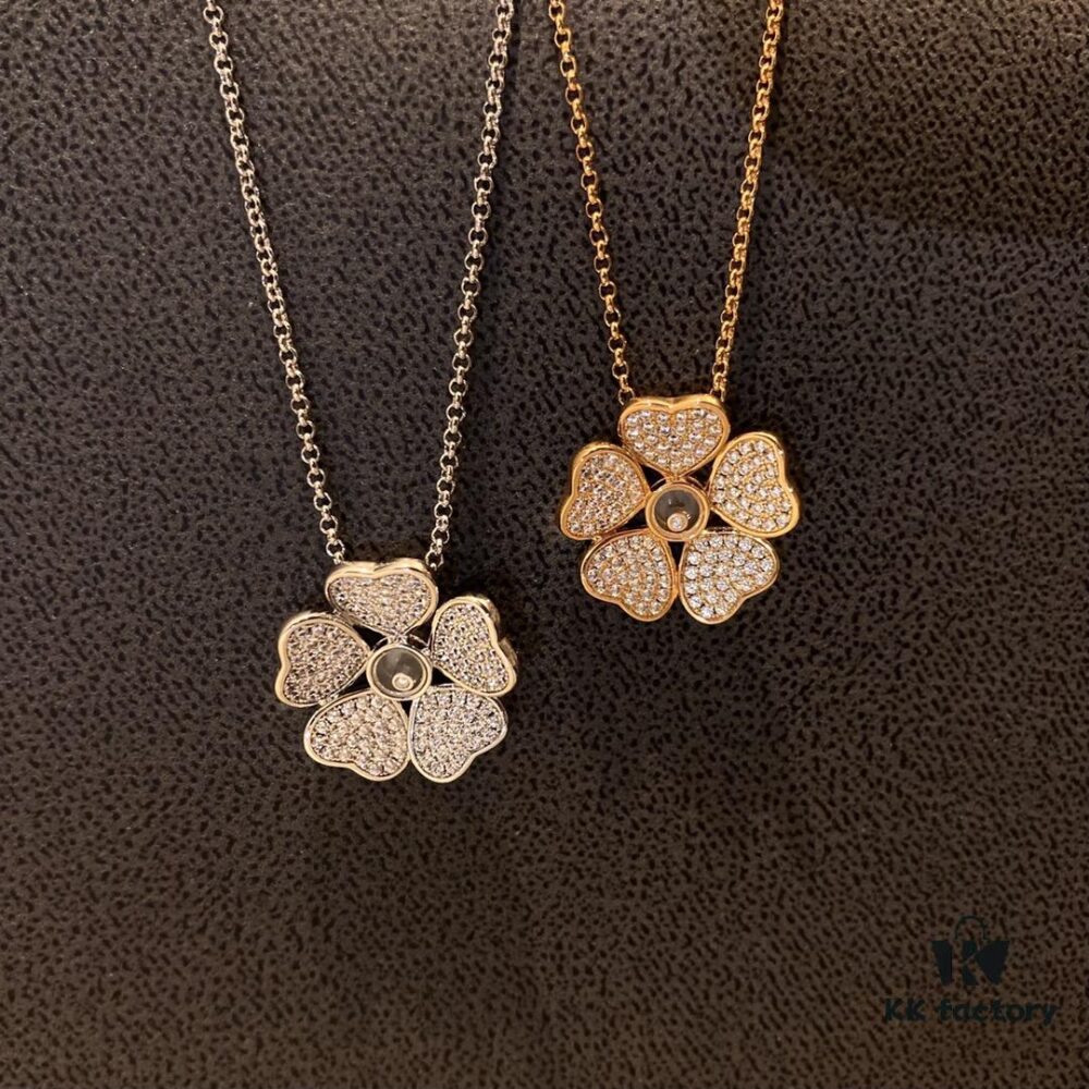Chopard Happy Hearts Flowers Necklace featuring a signature heart motif adorned with five diamond petals encircling a dancing diamond, exuding elegance and charm