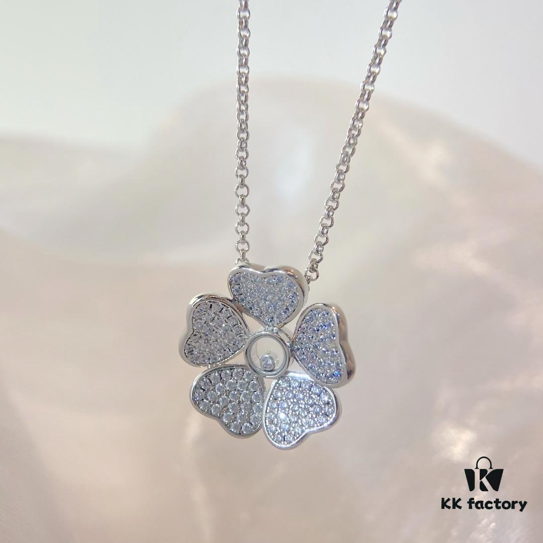 Chopard Happy Hearts Flowers Necklace featuring a signature heart motif adorned with five diamond petals encircling a dancing diamond, exuding elegance and charm