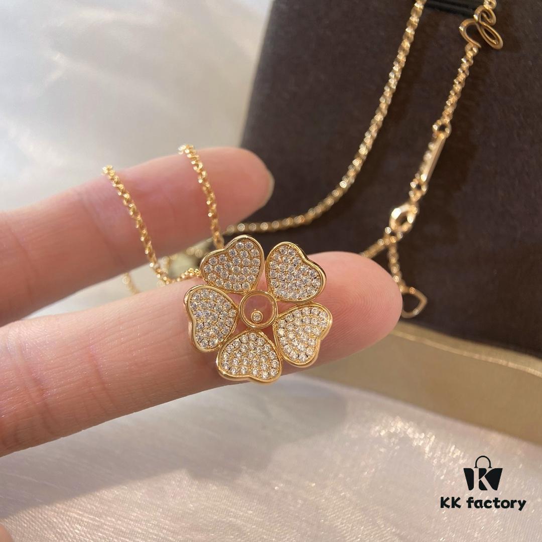 Chopard Happy Hearts Flowers Necklace featuring a signature heart motif adorned with five diamond petals encircling a dancing diamond, exuding elegance and charm