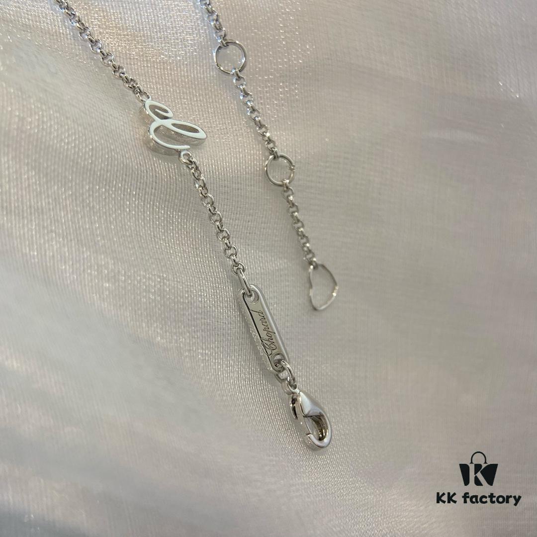 Chopard Happy Hearts Flowers Necklace featuring a signature heart motif adorned with five diamond petals encircling a dancing diamond, exuding elegance and charm