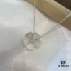 Chopard Happy Hearts Flowers Necklace featuring a signature heart motif adorned with five diamond petals encircling a dancing diamond, exuding elegance and charm