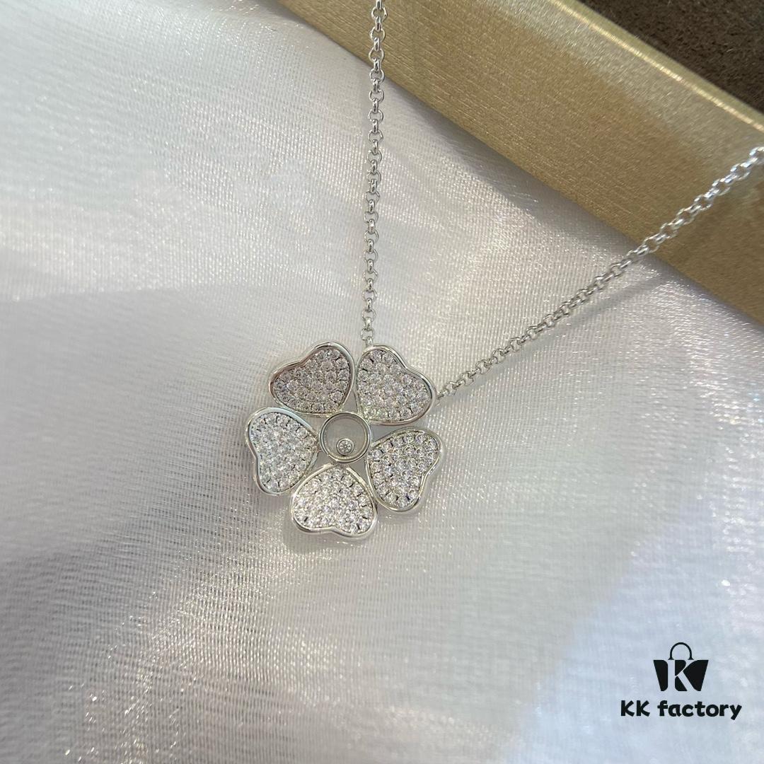 Chopard Happy Hearts Flowers Necklace featuring a signature heart motif adorned with five diamond petals encircling a dancing diamond, exuding elegance and charm
