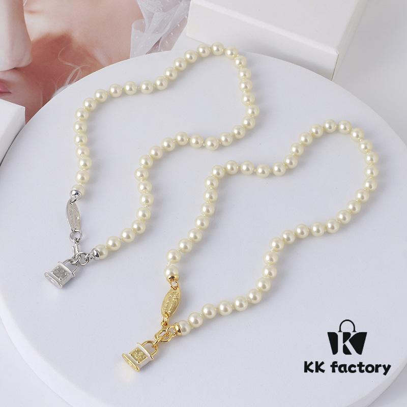Wholesale European and American Fashion Jewelry Saturn Pearl and Enamel 3D Small Lock Necklace for Women, Drop Shipping Available