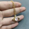 West Queen Saturn Necklace with Powder Diamond in Gold Color