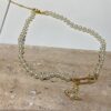 Saturn | Vivienne Westwood Jewelry - Brooch Style Pearl Necklace and Bracelet