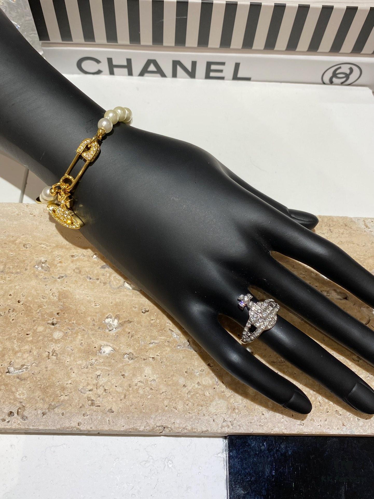 Saturn | Vivienne Westwood Jewelry - Brooch Style Pearl Necklace and Bracelet