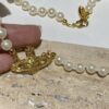 Saturn | Vivienne Westwood Jewelry Pearl Necklace in Gold