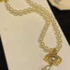 Vivienne Westwood Golden Saturn ORB Pearl Necklace