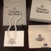 Vivienne Westwood Saturn Pearl Necklace - Medium Size, Rhinestone-Embellished Crown Pendant with Elegant Shine
