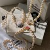 Vivienne Westwood Enamel Pearl Necklace with Magnetic Clasp, Double-Sided Wear, Saturn and Crown Design, Elegant and Edgy Style